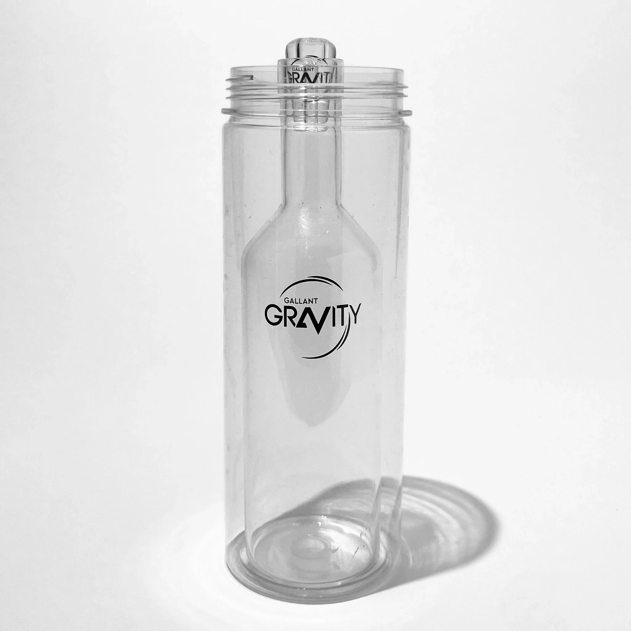 Clear glass gravity bong chamber with modern cylindrical design on white background