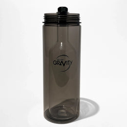 Smoky gray glass gravity bong chamber with modern design on white background