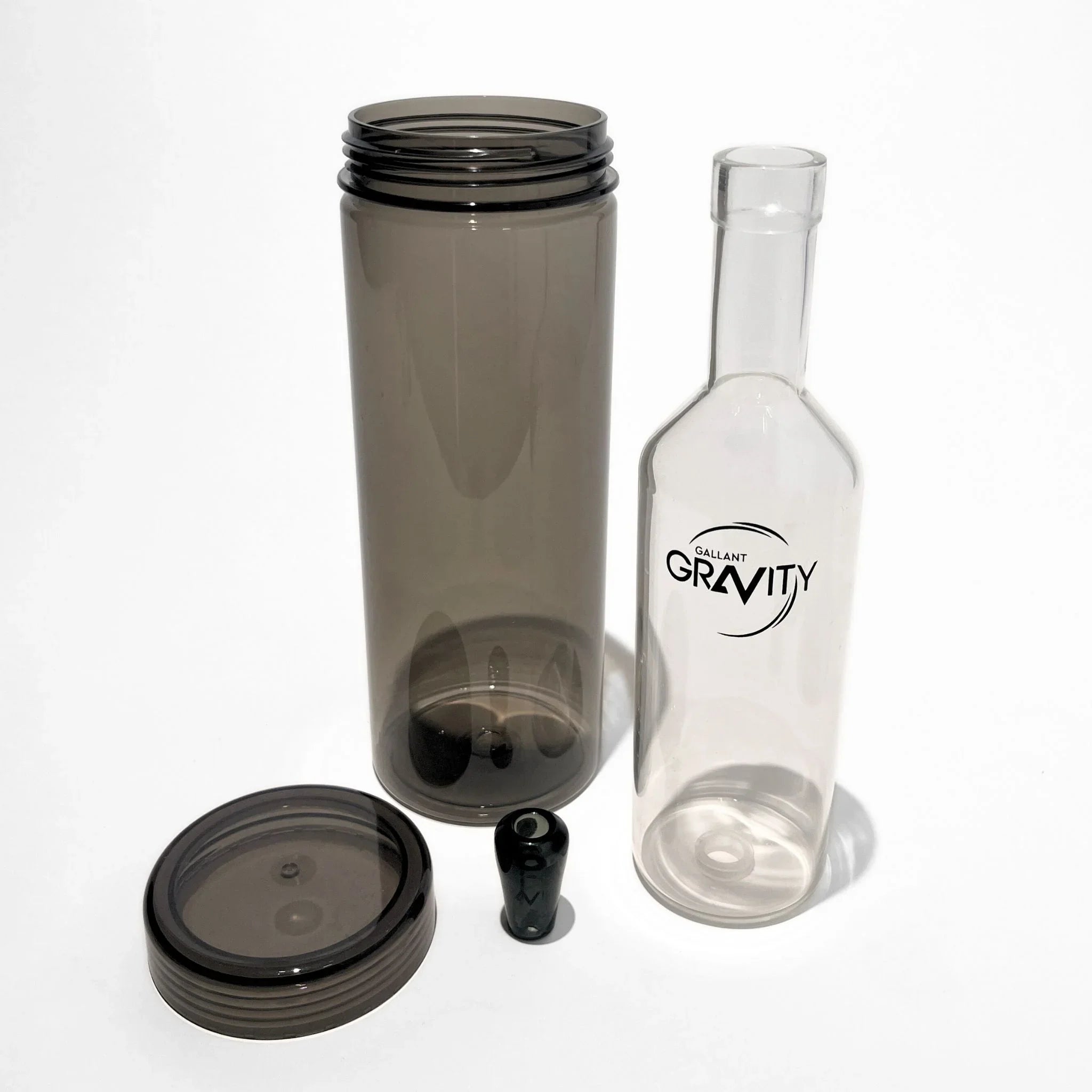 Modern glass gravity bong kit with clear and smoky components on a white background