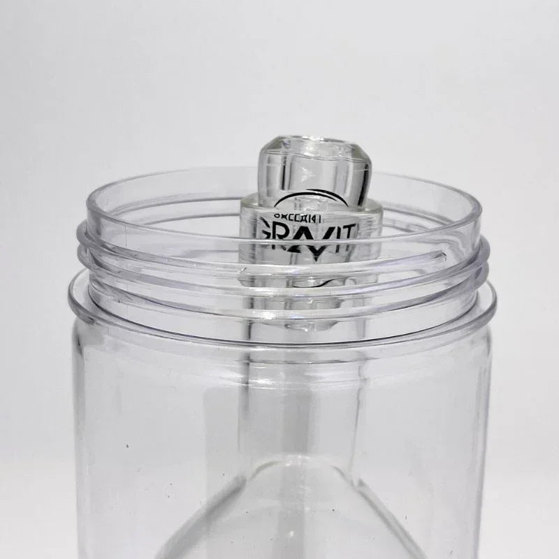 Clear glass gravity bong with modern design, close-up of mouthpiece and chamber