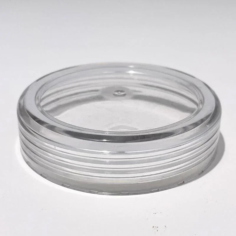 Clear plastic replacement lid for glass gravity bong on white background