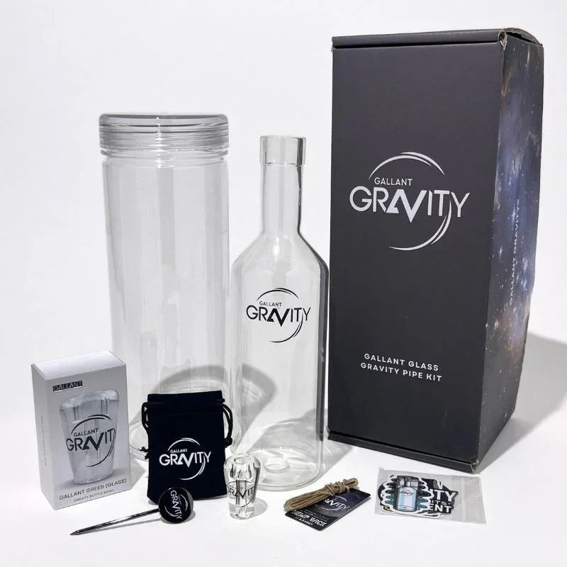 Glass gravity bong kit with bottle, cylinder, accessories, and branded packaging