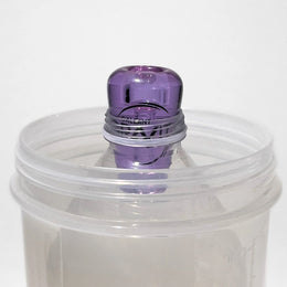 Amethyst glass greeb in bottle