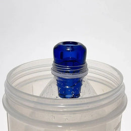 blue glass greeb in bottle